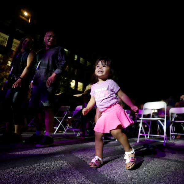 girl in pink skirt dancing at night