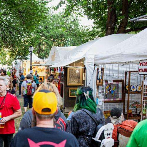 crowd of people perusing visual artists tents crowd of people perusing visual artists tents