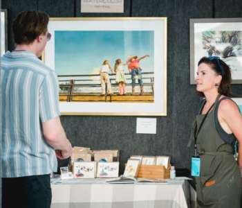 person looking at art prints