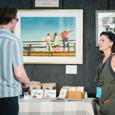 person looking at art prints