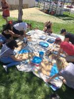 people painting boards