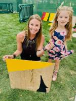kid and mother showing painted board